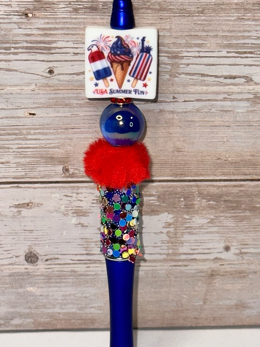 Patriotic Blue Decorative Ballpoint Pen with Red Pom Accent
